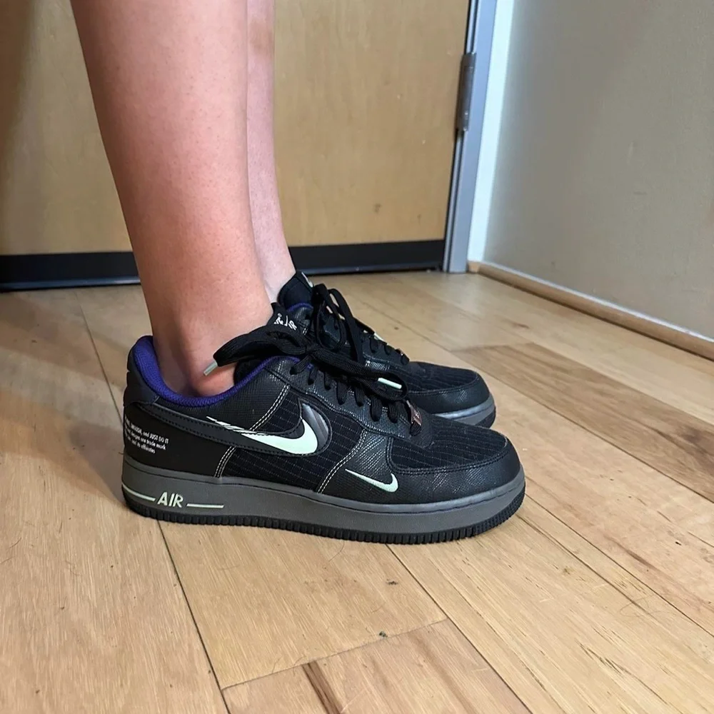 Nike Black and Purple Glow in the dark black AF1s Sneakers.